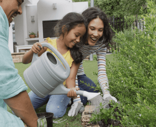 Happy Family Gardening Together