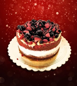 a cake with berries on a plate with a red background