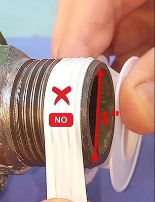 a person holding a pipe with a pipe sticking out of it