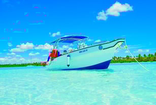 a boat in the water with a boat in the background