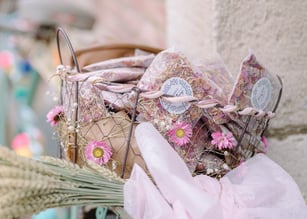 a bicycle with a wedding basket with pink flowers on it