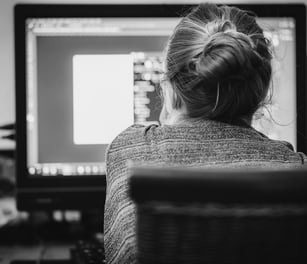 a woman working on a translation computer software