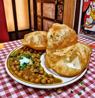 Chole bhature recipe, a plate of food with breaded bread and a bowl of soup