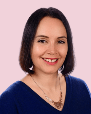 portrait of a woman smiling at the camera in a professional way