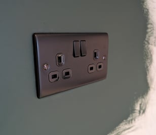 a black and white electrical outlet in a wall