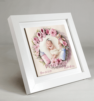 a baby's picture tile in a frame with a baby's picture in it