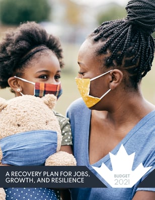 a woman in a blue shirt and a child in a blue shirt and a teddy
