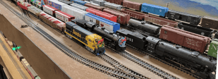 Pichacho Yard in Phoenix, Multiple trains parked decorated for Christmas.