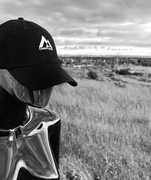 Dimensional being with a hat
