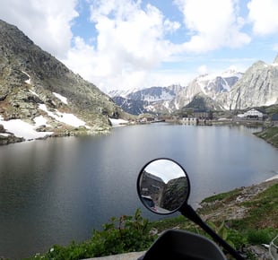 a motorbike parked in front of a mountain Mont Blanc