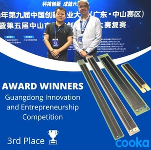 a man and woman standing in front of a blue and white banner