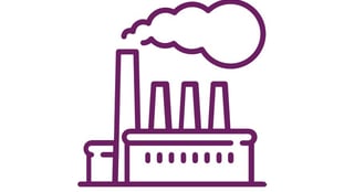 a factory with a factory with a large amount of smoke coming out of it