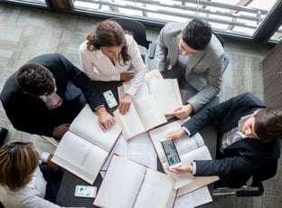 Team analyzing market trends and product positioning strategies – Zyncopra trade support