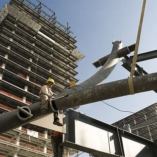 a construction worker on a craned in a construction site