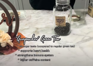 a jar of green teas and a jar of tea