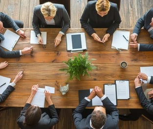 a group of business people in a meeting room