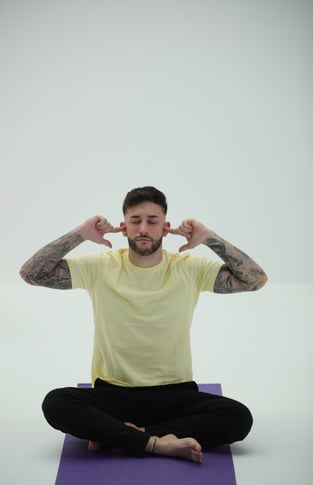 image of a man doing yoga 