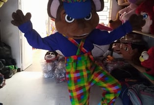 a person in a clown costume standing in a roomS DE PAW PATROL EN GREENVILLE