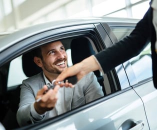  Happy customer because he just bought a car on lease.