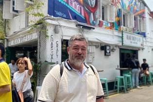 Image of Author: Jason A Ellis traveling the world, local area in Singapore