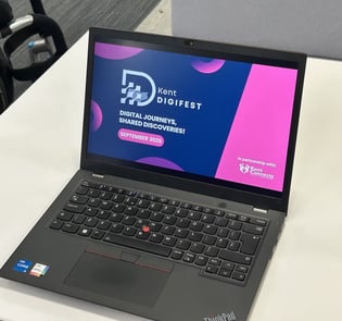 Laptop opened on Kent DigiFest powerpoint