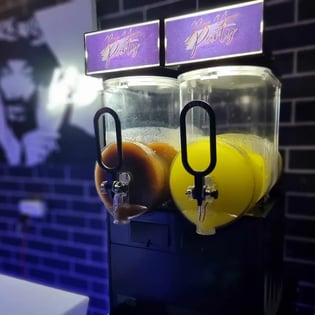 Slushie machine with Cola and Pina Colada slushie at hire event in Redlands.