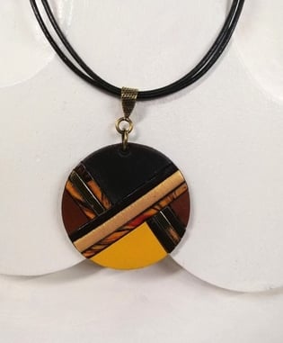 a necklace with a black and yellow necklace