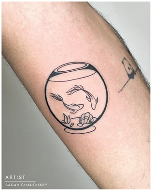 Photo of a fishbowl tattoo on the arm