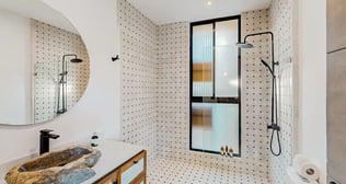 a bathroom with a sink and a large mirror