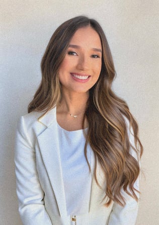 a woman in a white jacket and a white shirt