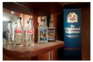 photograph of a coke bottle and a minibar