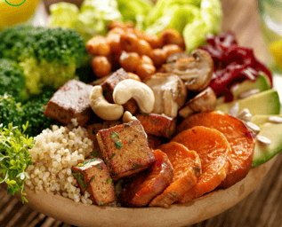 a bowl of vegan food with vegetables and tofu