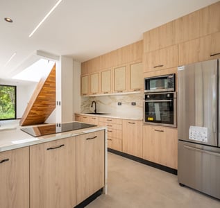 a kitchen with a stainless steel refrigerator and a stainless steel refrigerator