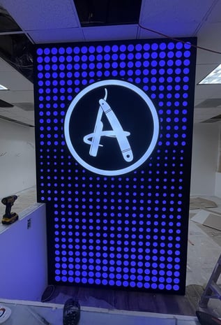A iluminated sign with a letter A
