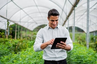 Happy hydroponics farmer free from his worries because AI is handling things for him 24x7