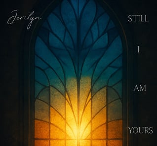 a window with a sun shining through a stained glass window