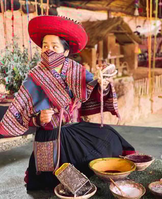 Portrait of a Peruvian woman making handicrafts in the Sacred Valley near Cuzco.