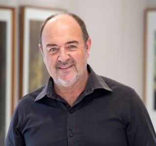 Portrait of Martin Osner, South African fine art photographer and visual artist, in his art gallery