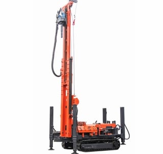 a drilling machine with a man standing in front of it