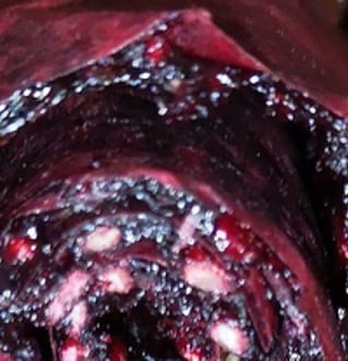 Dehydrated, rolled up deep purple fruit