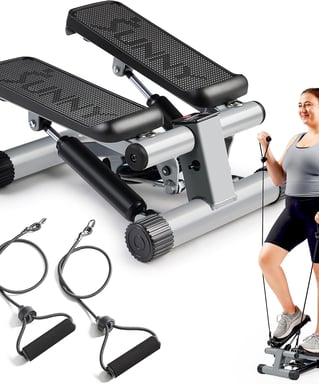 a woman standing on a stationary stepper