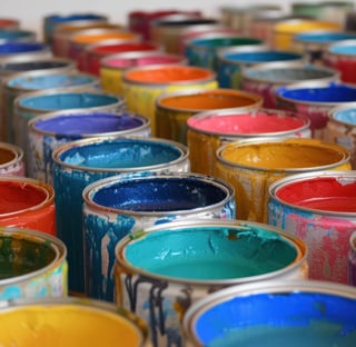 many different paint cans