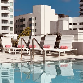 pool in girls enjoying at a party with buildings in the background 