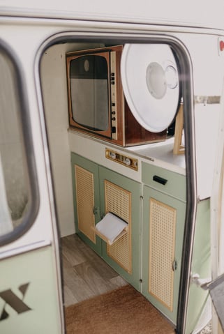 a small kitchen with a microwave and a microwave