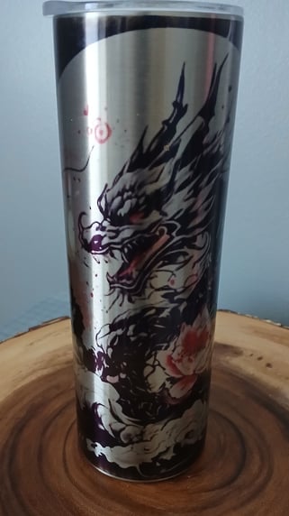 A sublimated 20oz tumbler featuring a traditional Japanese dragon wrapping around the tumbler 