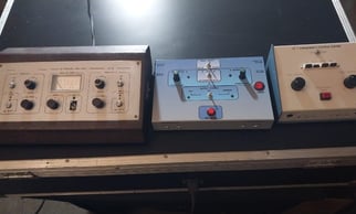 a group of three electronic devices sitting on a table