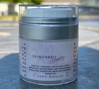 a jar of skin care products sitting on a table