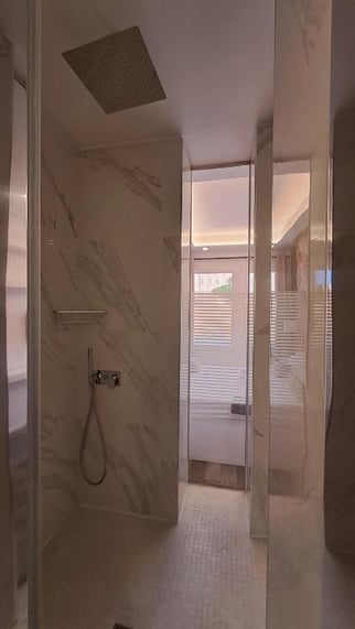 a bathroom with a shower and a shower