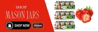 a strawberry cream jar with a strawberry on top of it and a strawberry on the