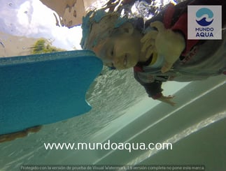 a young child swimming in the water